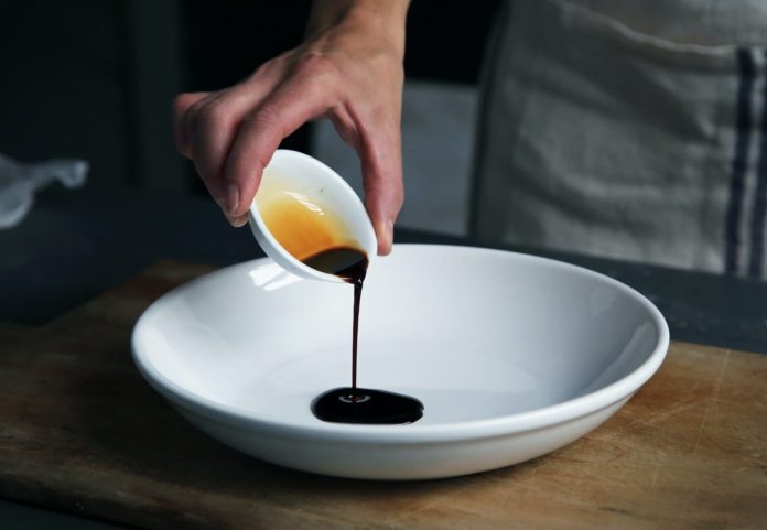 Balsamic vinegar poured onto a plate