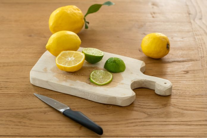 Cutting board with lemons and limes