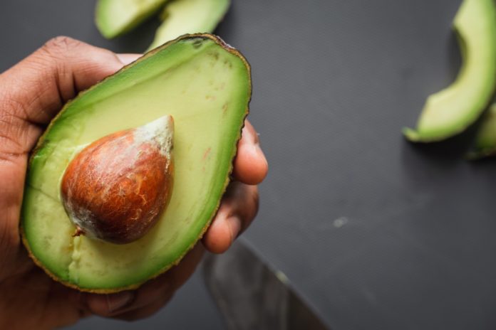 Foods with fiber: an avocado cut in half