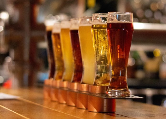 A long line of beers in glasses