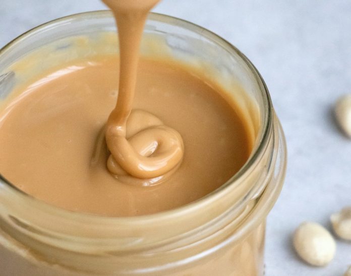 Smooth, creamy peanut butter in a jar