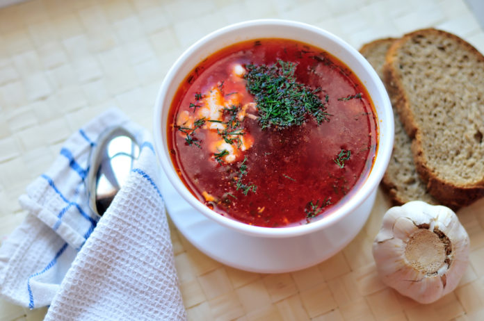 Russian red-beet soup (borscht) with garlic and sour cream