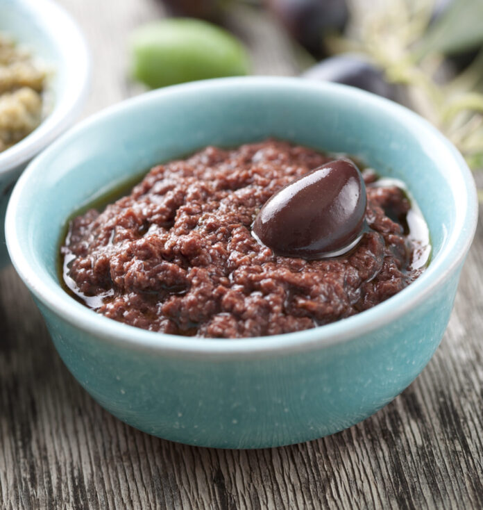 bowls with fresh olive paste made from kalamata olives