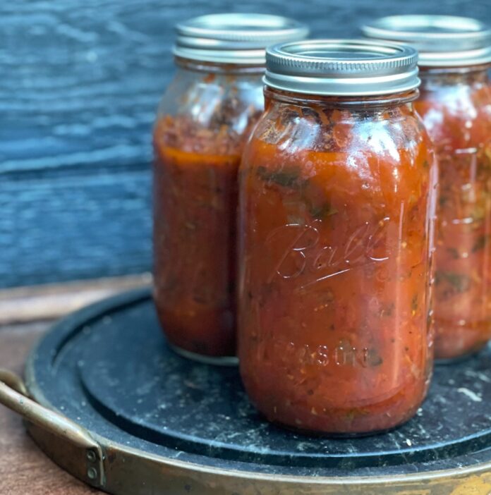 Three jars of red salsa